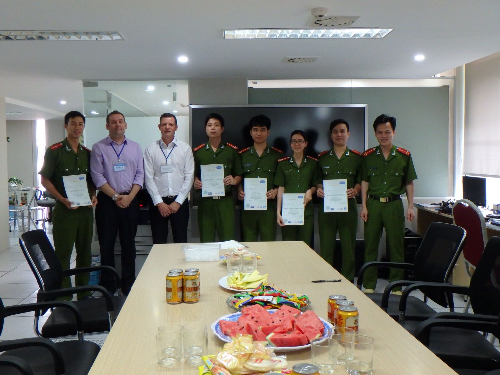 A group of officers standing in front of a table with a certificate